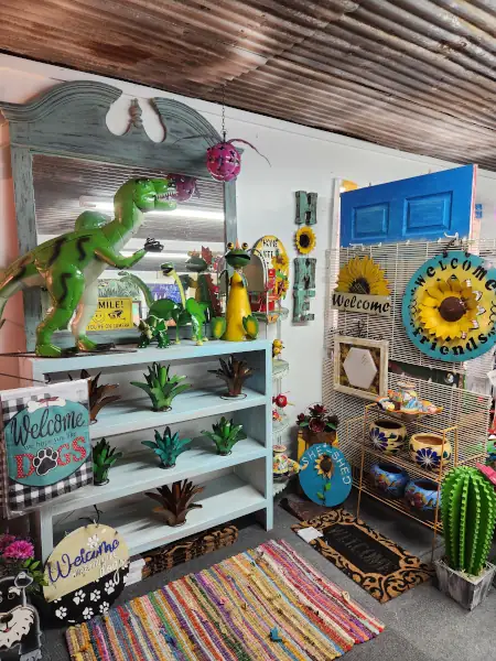 Colorful Mexican-inspired pottery, painted chiminea, and metal butterfly wall art at Cantaimer Shopping in Hico, Texas