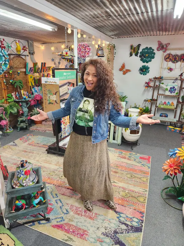 Cantaimer Shopping owner welcoming customers with open arms inside the colorful Hico, Texas gift shop